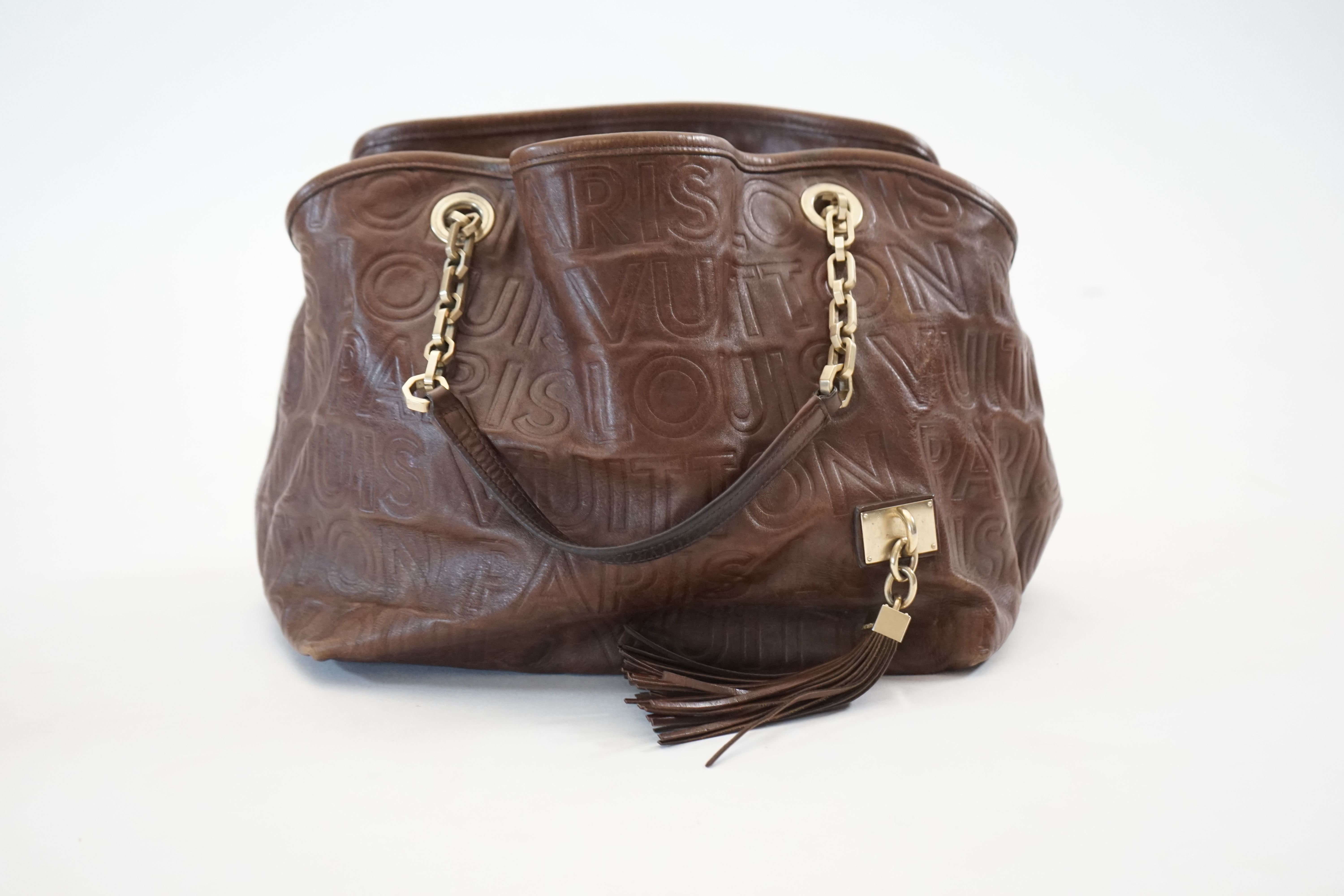 A Louis Vuitton Whisper brown leather handbag, width 31cm, depth 22cm, approx height 26cm